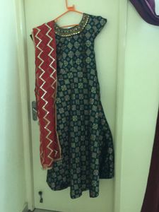 Silk green colour Anarkali salwar with red colour Shawl.Used only once good condition