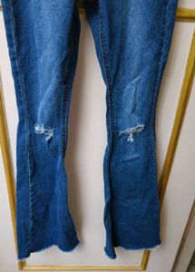 Trendy Flared Jeans with Ripped Knees