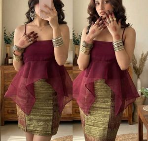 Exquisite Maroon Peplum top with golden mini skirt