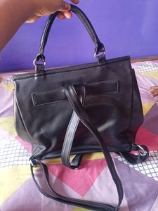 black handbag cum backpack style bag.