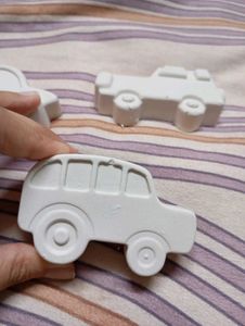x3 pieces of concrete art cars