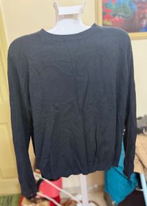 black woolen top .