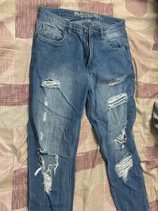 Distressed Blue Denim Jeans