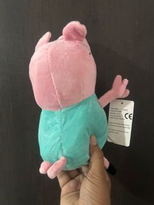 Daddy Pig from Peppa holding his briefcas