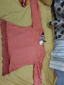 Elegant Coral Kurta with Lace Detailing