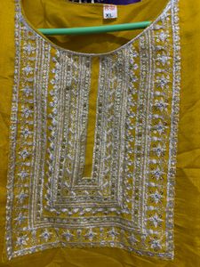 Elegant Yellow Kurti pant with Intricate Neckline