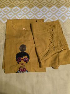 Stylish Mustard Kurta Set with Embellished Necklin