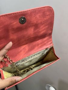 Stylish Red Crossbody Bag with Gold Embellishments
