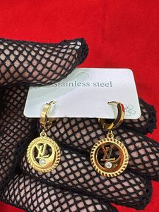Gold Tone Hoop Earrings with Crystal Accent