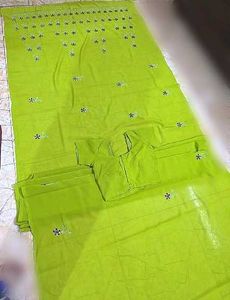 It's a Green coloured saree with blouse