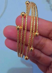 Elegant Gold Tone Coil Bracelet