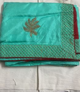 Elegant Teal Saree with Gold Embroidery