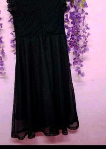 Elegant Black Lace Dress with Red Floral Detail