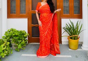 Vibrant Orange Bandhani leheriya Saree