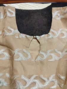 It's Beige color Gown.  I