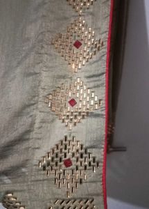 Elegant Beige Saree with Gold Embellishments