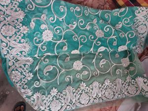 Elegant Embroidered Teal Net Saree