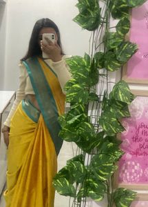 Elegant Yellow Saree with Teal Border