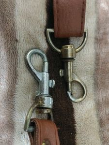 Small adjustible shoulder belt for vanity bags.