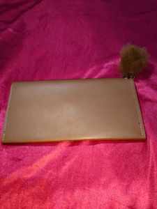 Chic Tan Clutch with Pom-Pom
