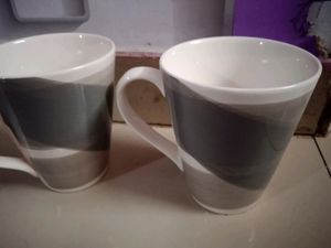 A PAIR OF MUGS WITH MOSAIC COLOUR EFFECT