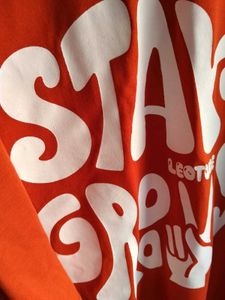 Orange "Stay Groovy" Graphic Tee