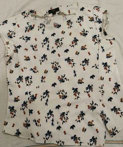 Looking for a trendy white top? Here it is