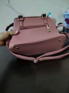 Stylish Pink Textured Handbag with Charm