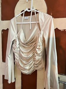 beige top with unique and catchy neckline