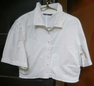 Stylish white Zudio top paired with black slim-fit