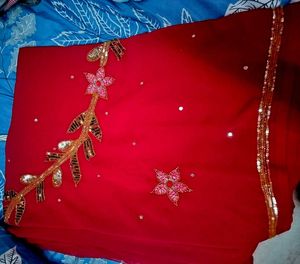 Elegant Red Saree with Floral Detail