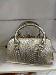 Elegant Gold Embossed Handbag