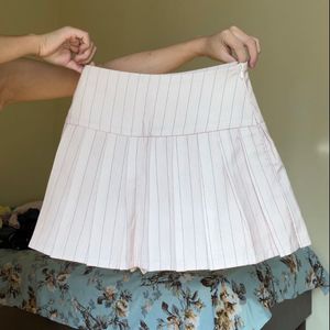 high-waisted pleated mini skirt