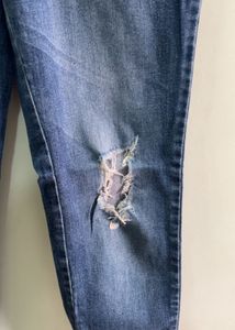 Distressed Blue Denim Jeans