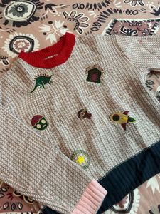 Whimsical Patched Sweater