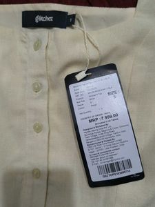Cream Peplum Button-Up Top