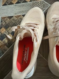 peach color sneakers