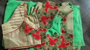 green colour saree with heavy cutwork border in pallu and golden work border all ever with stitched blouse