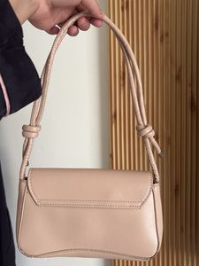 chic nude color side bag with golden buckle