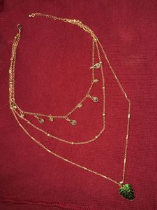Gold Tone Layered Necklace with Green Leaf Pendant