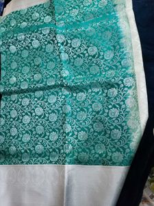 Elegant Teal Saree with Silver Floral Motifs