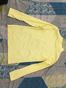 high neck pastel yellow top with embroiderd cat