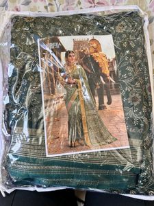 Elegant Green Saree with Intricate Gold Print