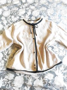 Chic Cream Knit Cardigan with Black Trim