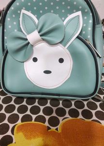 Cute Teal Crossbody Bag with Charm and keychain.