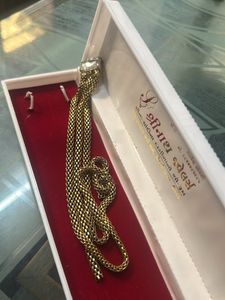 gold snack chain brooch with diamond