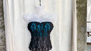 1110. Sheer Lace Strapless Peplum Top
