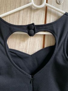 Chic Black Peplum Top with Heart Cutout