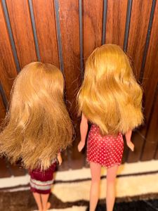 Two barbie dolls