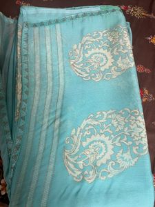 Elegant Teal Saree with Intricate Design
